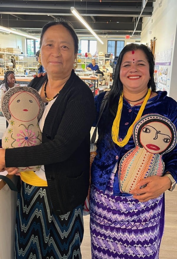 Women of Stitch Buffalo with stitched dolls