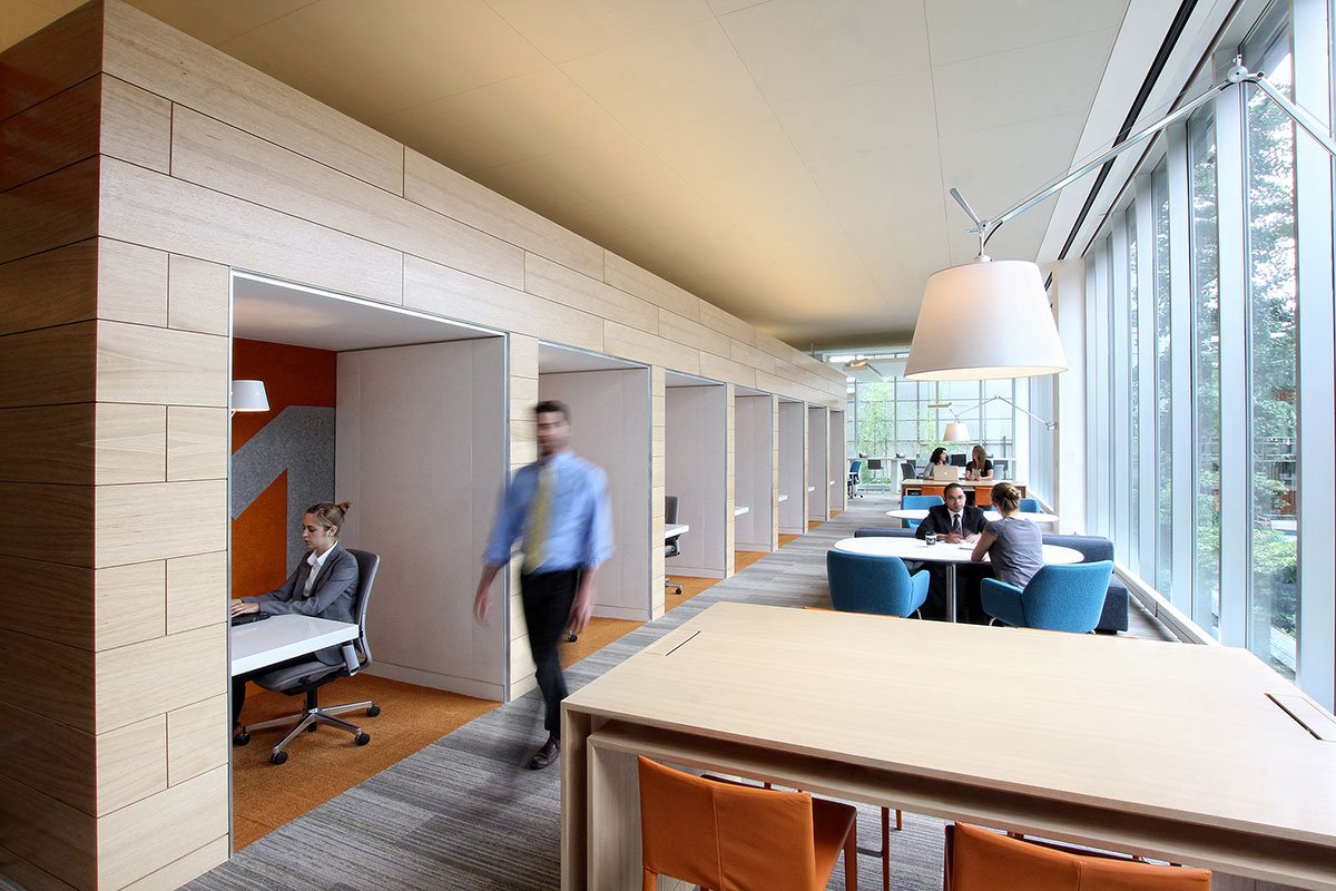 Financial Services Corporation private work areas with orange walls angled view