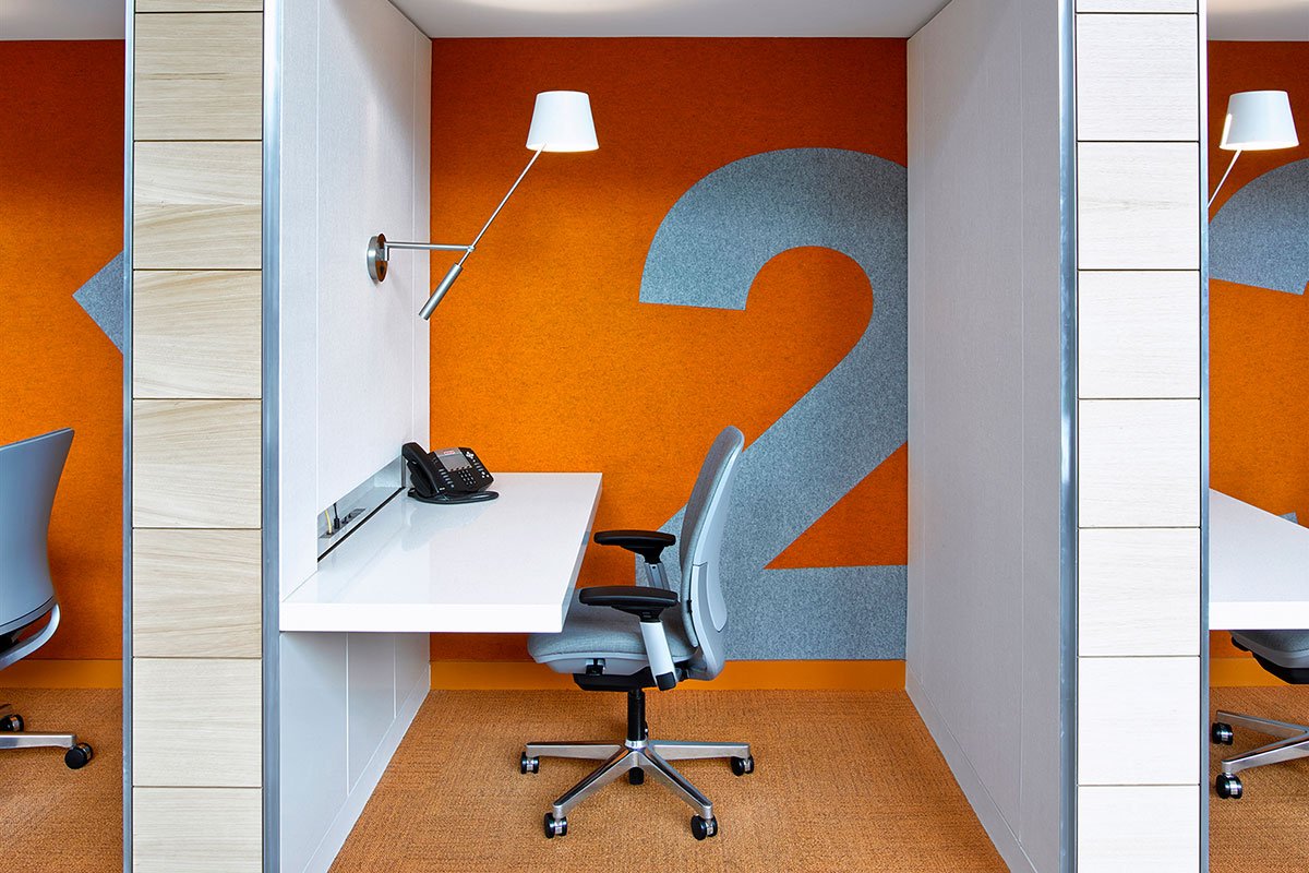 Financial Services Corporation private work area with custom orange felt walls 